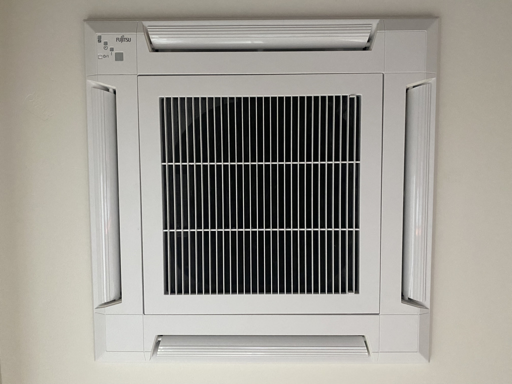 Ceiling air handler unit for heat pump