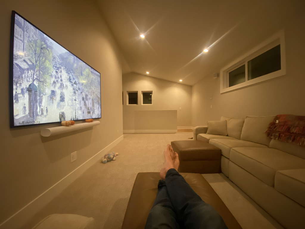 Completed upstairs TV room with sectional couch