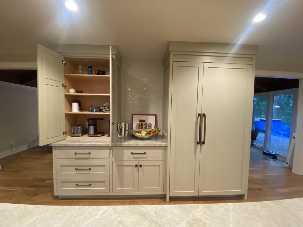 Sub-Zero panel-ready refrigerator in kitchen cabinets