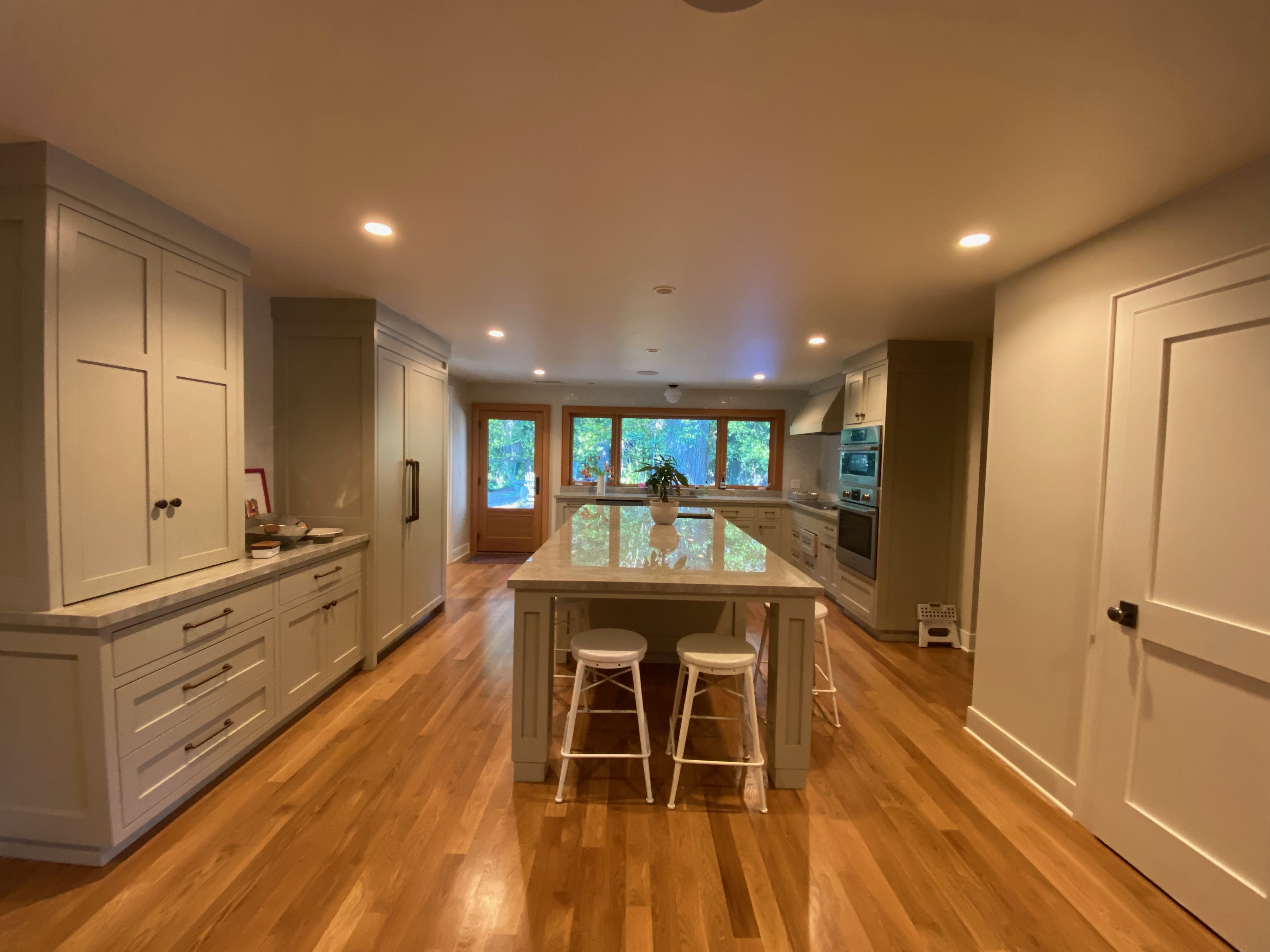Completed kitchen - wide view showing island and cabinets