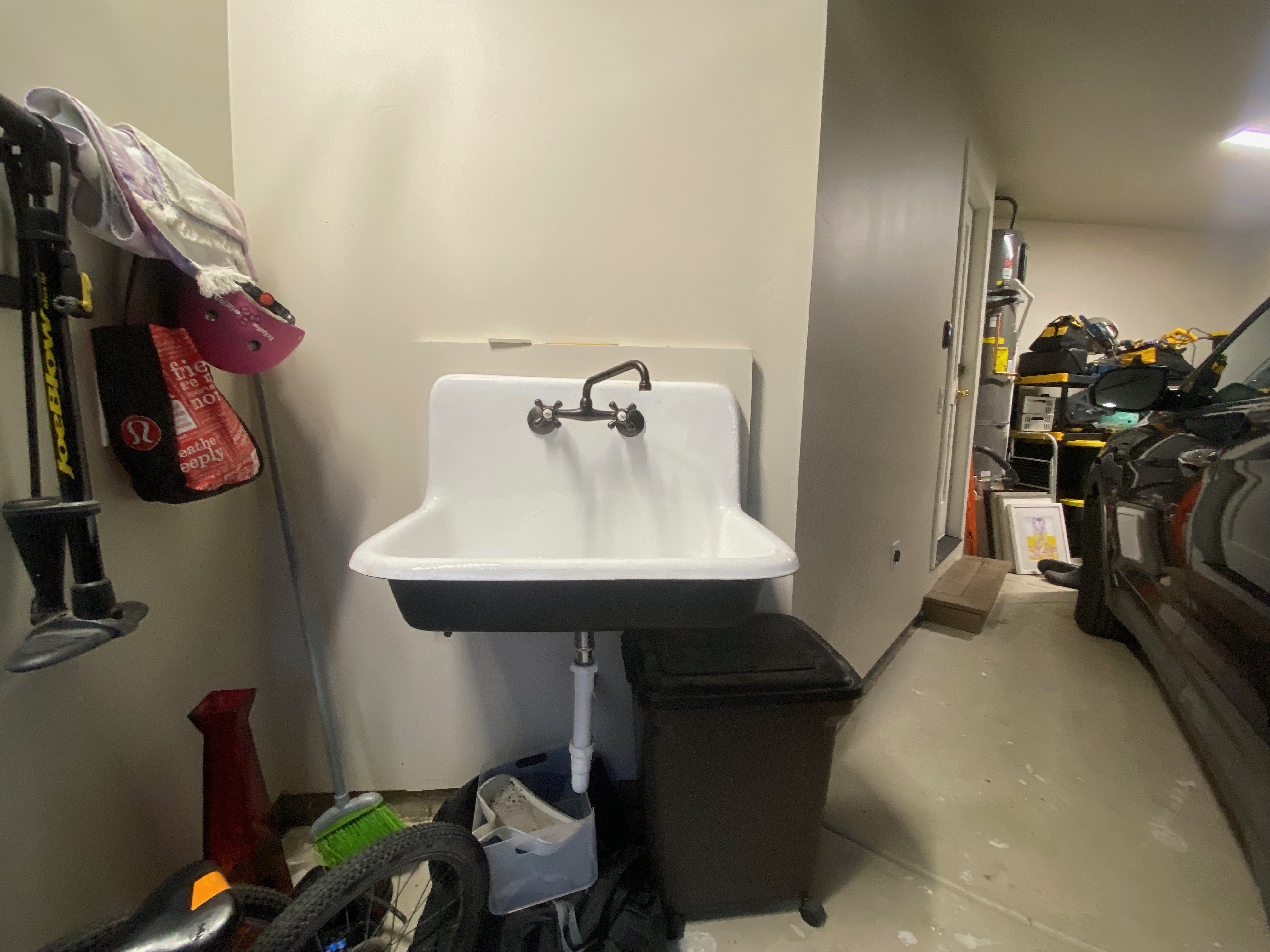 Finished garage with utility sink and organization