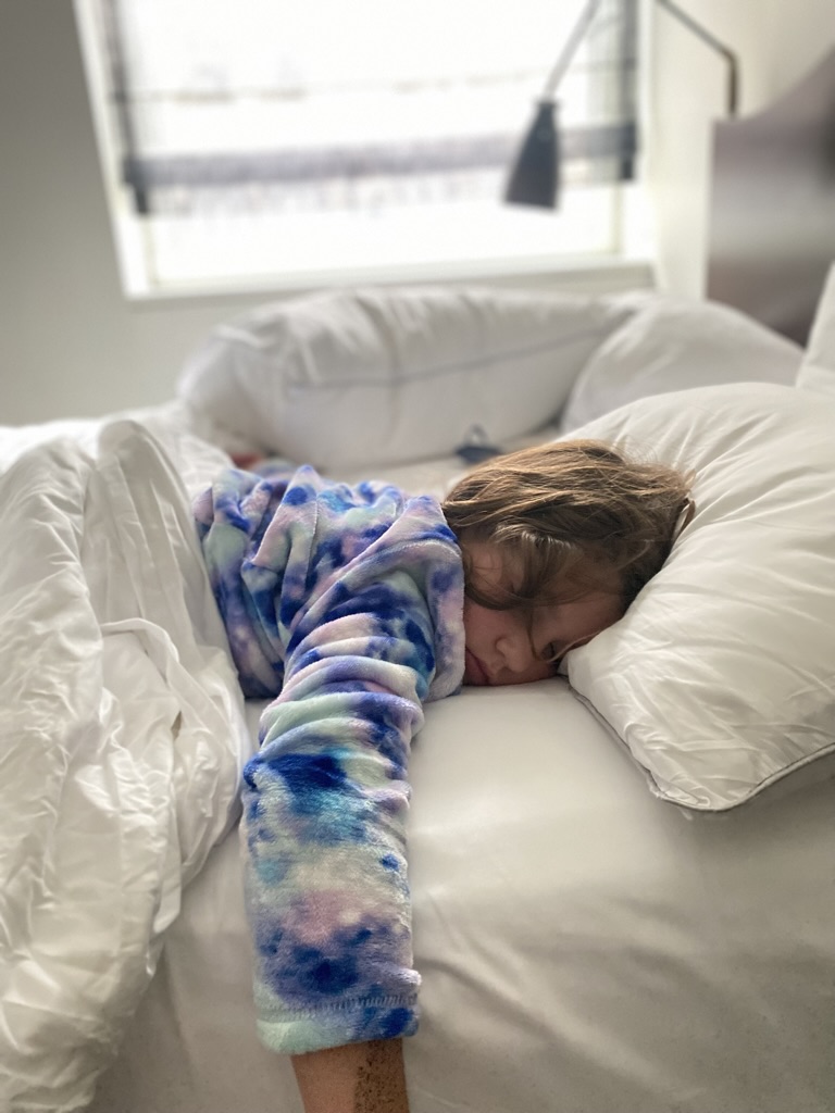 Lily sleeping in hotel room