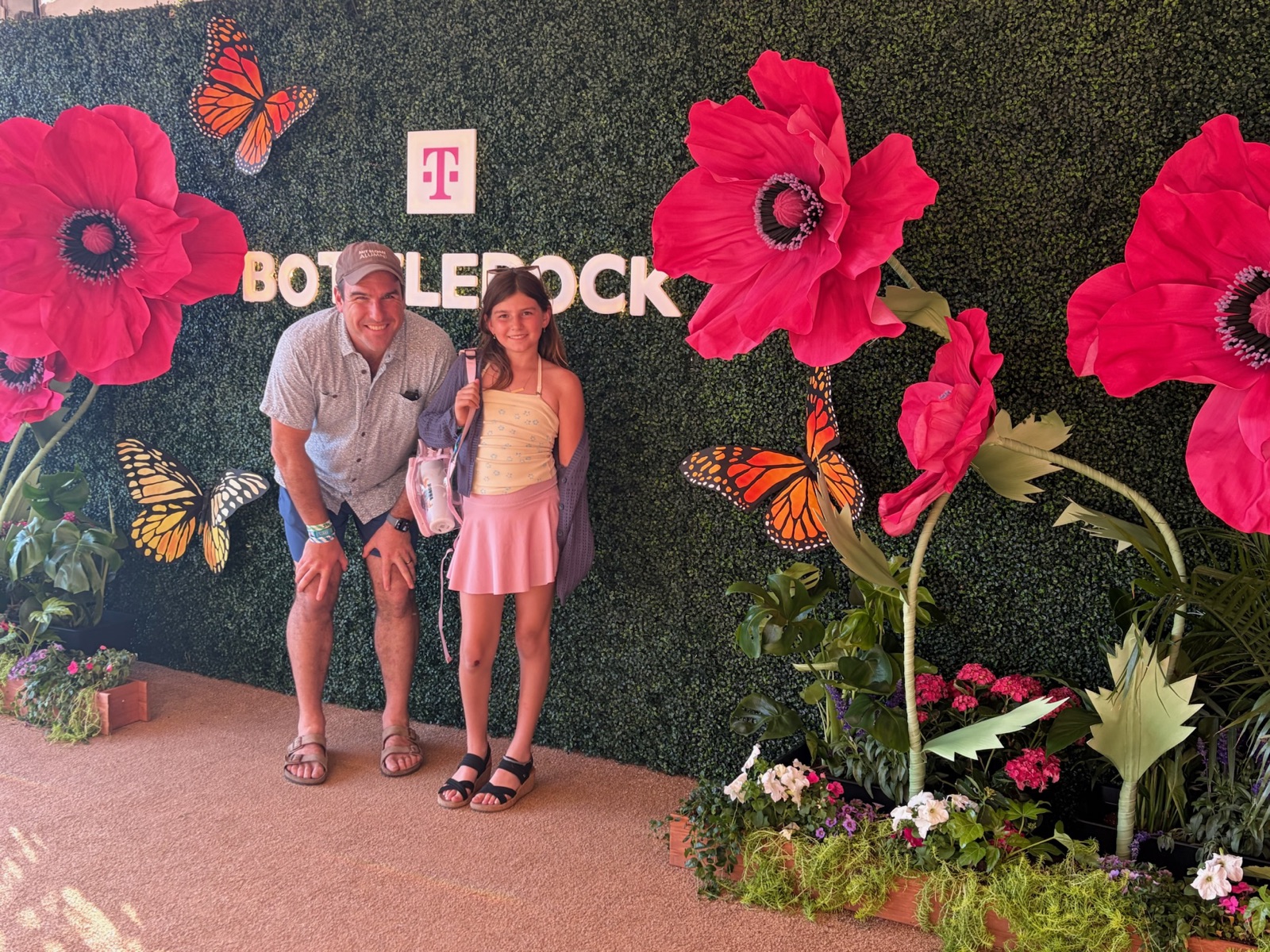 Lily and me in front of the flower wall at BottleRock