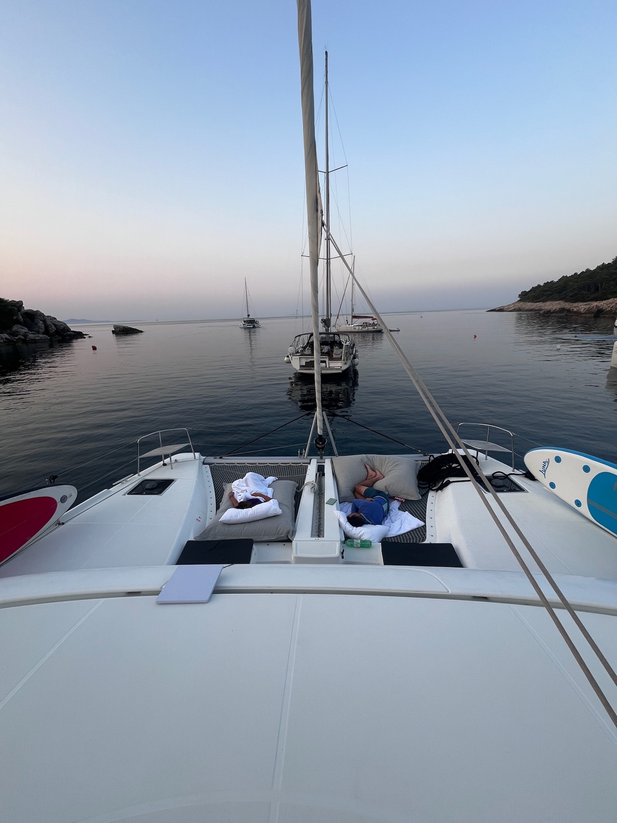 Early morning on the trampoline of Summer Magic, anchored off one of the islands