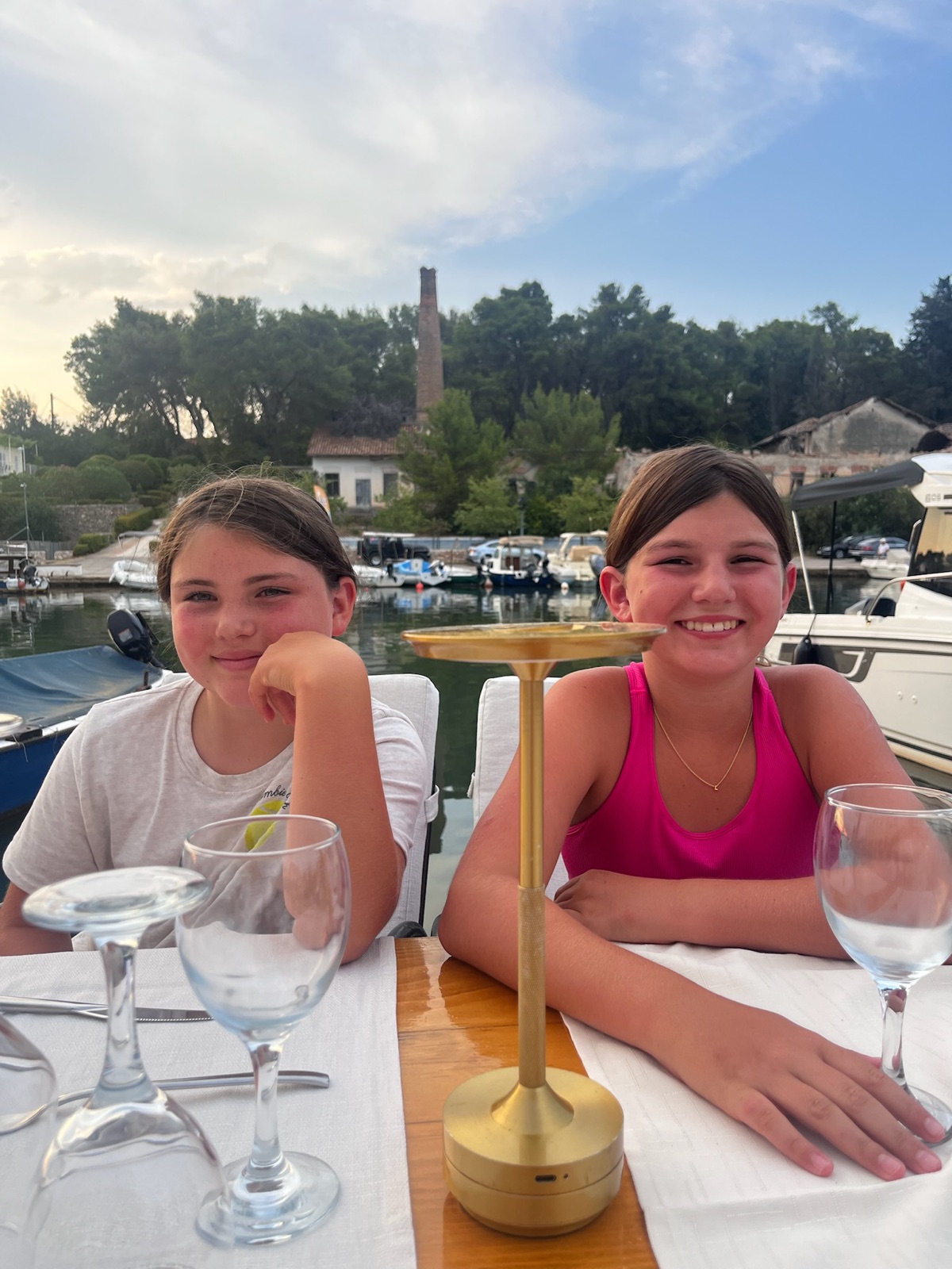 The girls at dinner in one of the small island harbors