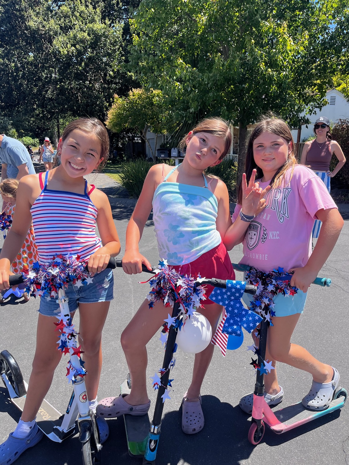 The girls with their scooters decked out for the Fourth of July