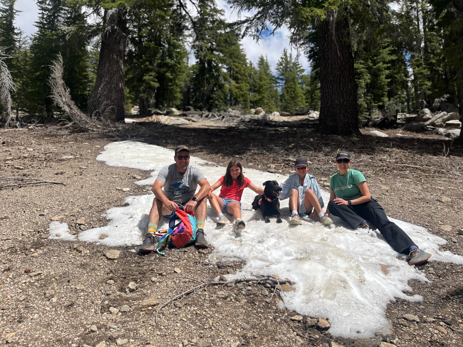 Sitting on a patch of leftover snow on the hike from the Giannelli trailhead